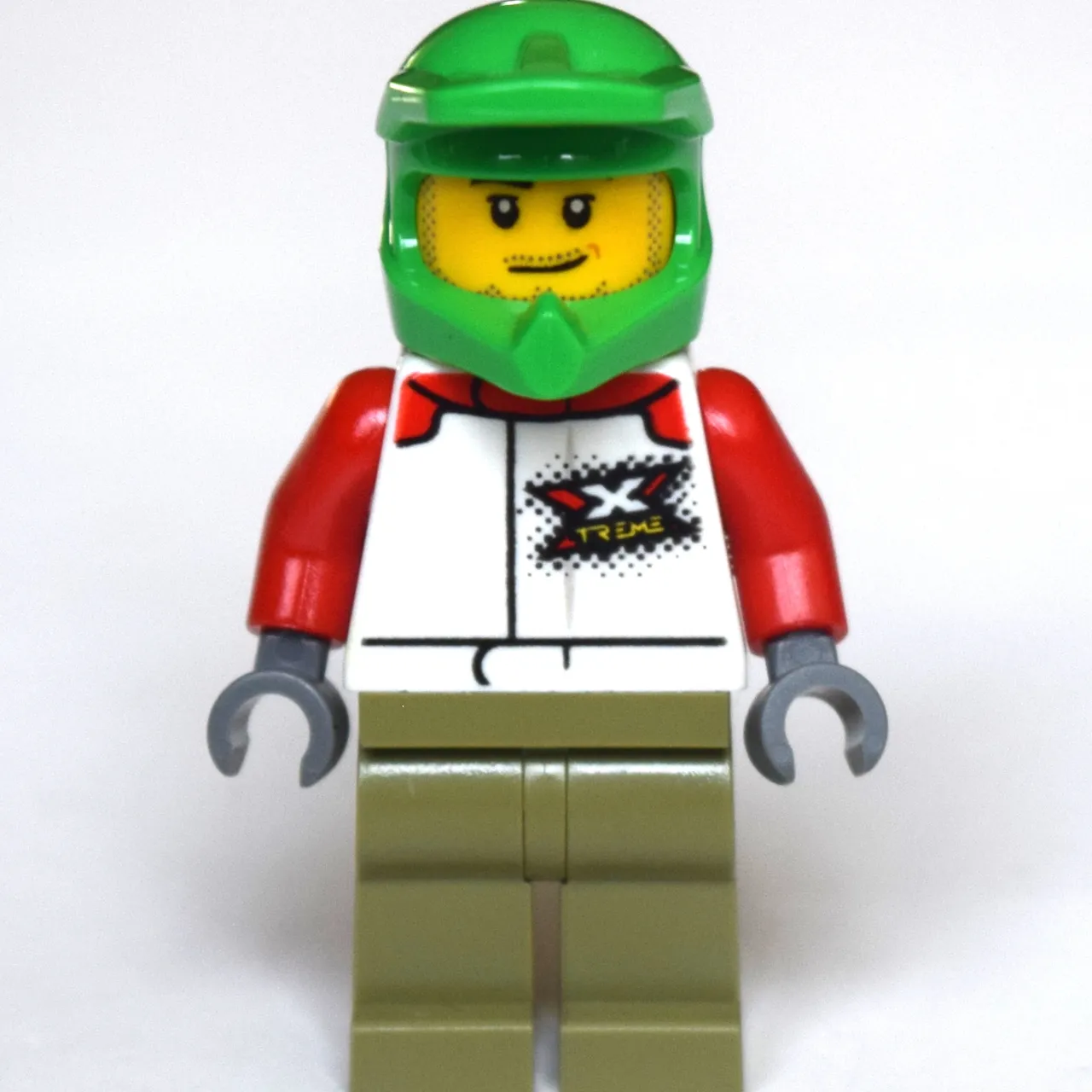 Man, White Racing Jacket, Olive Green Legs, Green Dirt Bike Helmet, Stubble