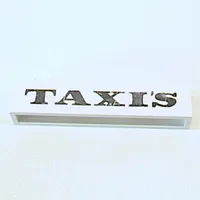 Brick 1 x 6 without Bottom Tubes with Cross Side Supports with 'TAXI'S' Serif Bold Black Print