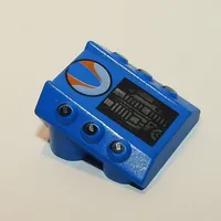 Slope 2 x 2 No Studs, with 3 Side Pistons Raised Edges and Surfer Print